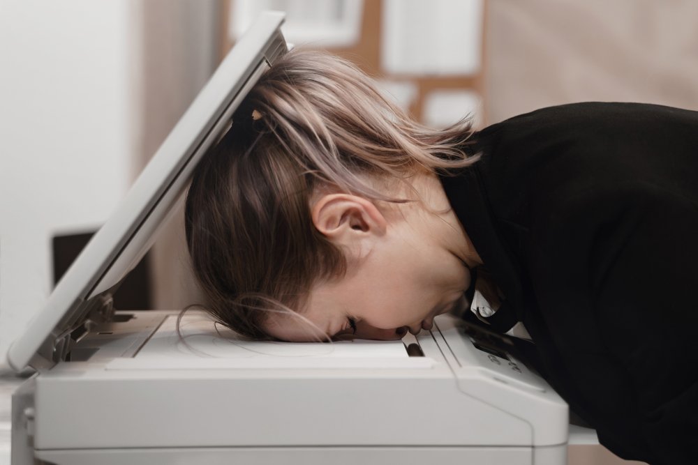 Businesswoman,Sleeping,On,Printer,At,Office.,Overworked,Concept.